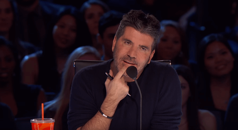 Simon Cowell Leaps Out Of His Chair To Hit…