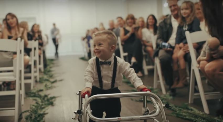 Little Boy With Down Syndrome Is The Wedding’s Ring Bearer. Watch Him Walk The Aisle HERE!